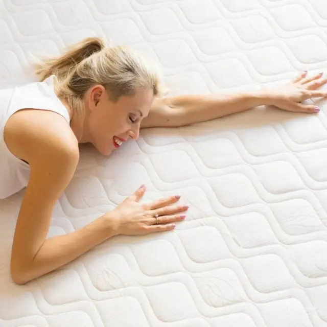 person laid on mattress